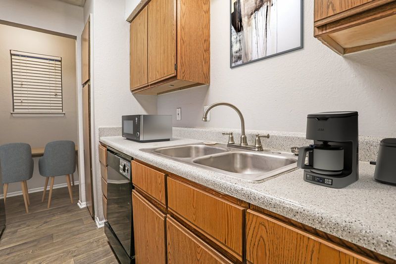 Dakota apartment kitchen with wood cabinets